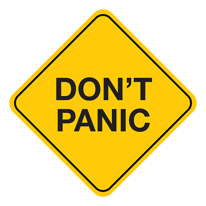 Vector illustration of a black and gold colored road sign with the words don't panic on it.
