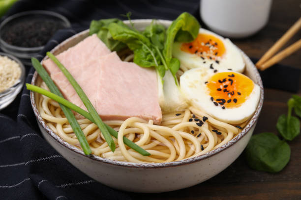istock Delicious ramen with meat on table, closeup. Noodle soup 1908341378