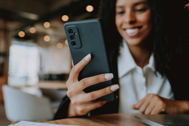 istock Young businesswoman using smartphone 1908372635