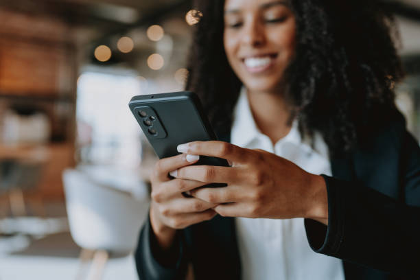 istock Young businesswoman using smartphone 1908378344