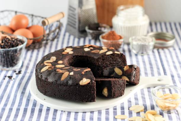istock Chocolate Brownies Decorated with Almond Slice on Dark Background 1908385146