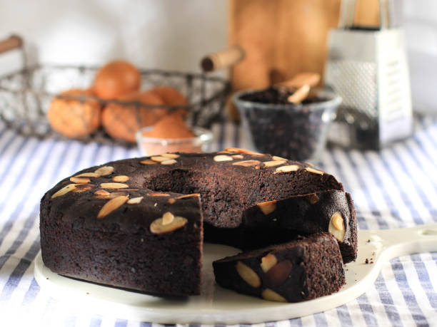 istock Chocolate Brownies Decorated with Almond Slice on Dark Background 1908386191