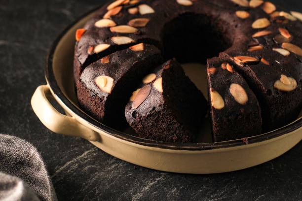 istock Chocolate Brownies Decorated with Almond Slice on Dark Background 1908388248