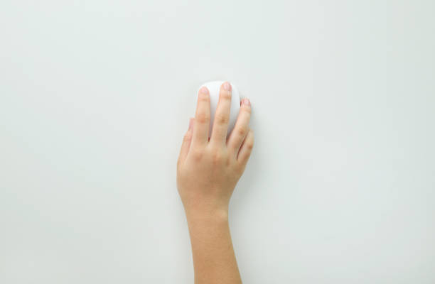 Hand of woman using modern wired optical mouse bluetooth searching online isolated on white background, flat lay, top view. Space for text. Digital network technology concept.