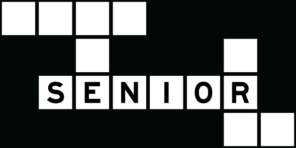 Alphabet letter in word senior on crossword puzzle background