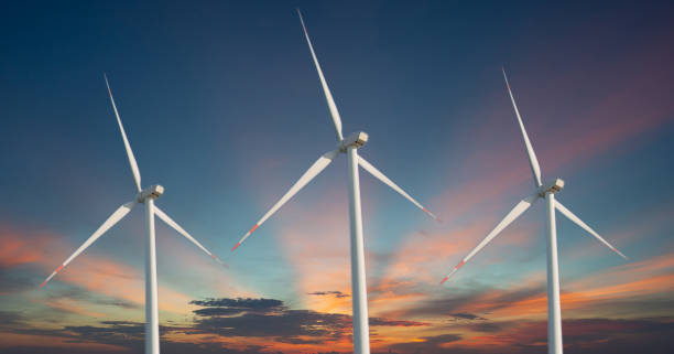 istock Three windmills on a sky background with sun rays Image of alternative energy, clean energy natural energy love the world and the environment 1908470298