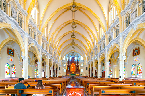 Vung Tau, Vietnam - August 6th, 2023: The view inside Song Vinh parish church built in French Gothic architecture attracts parishioners to pray for peace in life
