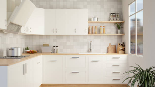 istock A modern, Scandinavian kitchen with white wall cabinets and counters and tiles wall. 1908483813