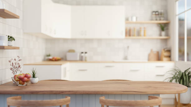istock Close-up image of a wooden dining table in a modern, Scandinavian kitchen. 1908484190