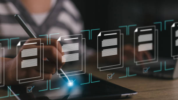 istock Women to tick marks on virtual screen documents for online approve paperless quality assurance and ERP management. Prepare check and approve concepts. Document management, paperless concept. 1908567855