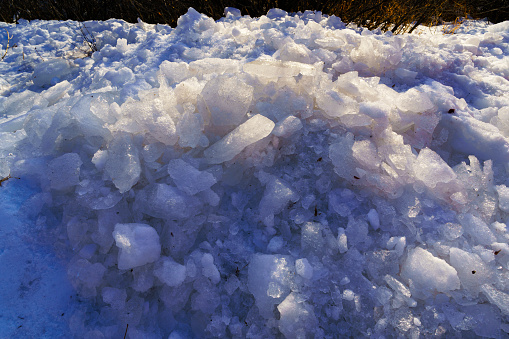 Ice Chunks Pile - Ice crystals backlit by warm sunlight.