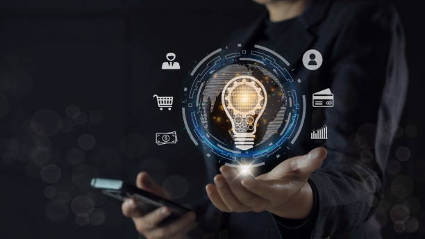 istock businessman holding light blub with virtual Global Internet connection. global internet connection application technology and digital marketing, Financial and banking, Digital link tech, big data. 1908626770