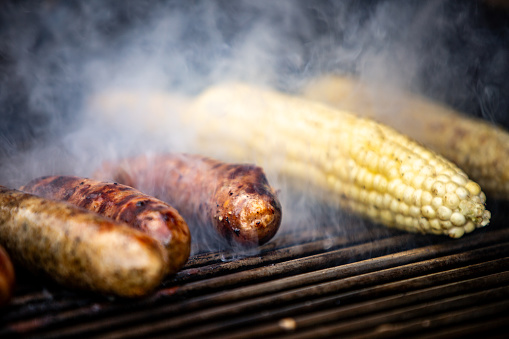 Cooking Sausages and Corn on a grill