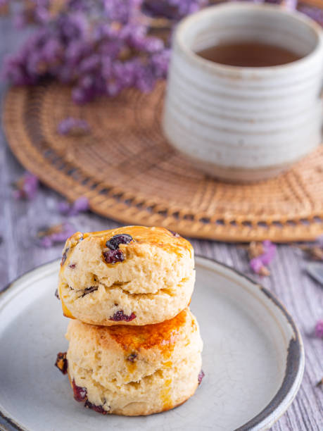istock Traditional British scones with a tea cup and blurred background 1908685485