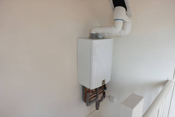 istock Modern gas boiler on beige wall indoors, space for text 1908689718