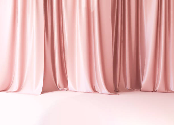 istock Modern pink drapery curtain on stage floor in sunlight from window 1908691798