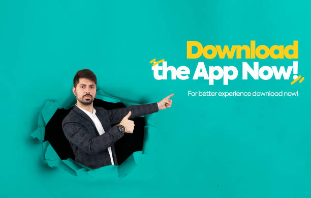Download the app now. A young man pointing towards the App. Download App now for better experience poster. A Young man coming out of the wall and promoting mobile application. Mobile App Promotion. Download the app now. A young man pointing towards the App. Download App now for better experience poster. A Young man coming out of the wall and promoting mobile application. Mobile App Promotion. download festival stock pictures, royalty-free photos & images