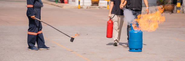 istock Fire training and drills for factory workers, for fire protection and safety. 1908698293