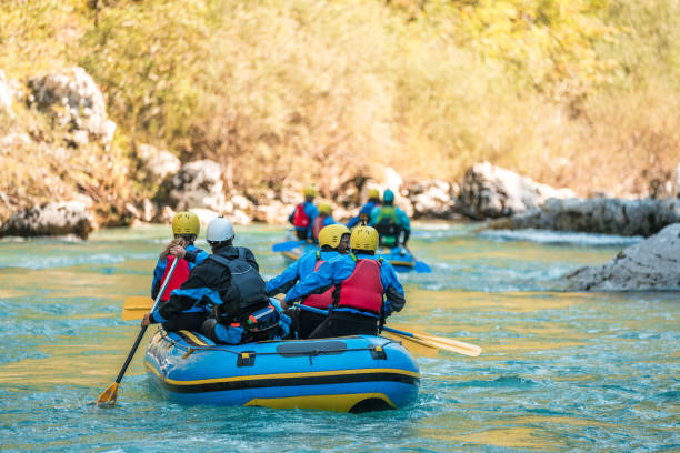 istock Mid Adult Diverse Rafting Team with Guide in Swift River Currents 1908707688