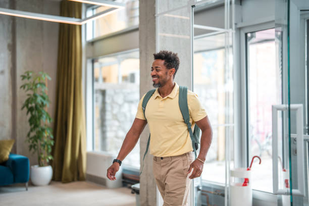 istock Mature Male Employee Arriving In Modern Office Space 1908714909