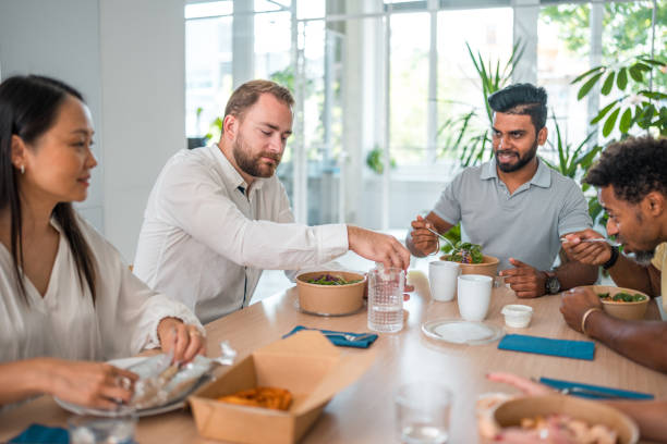 istock Good Looking People At Multiracial Lunchtime Gathering 1908717041