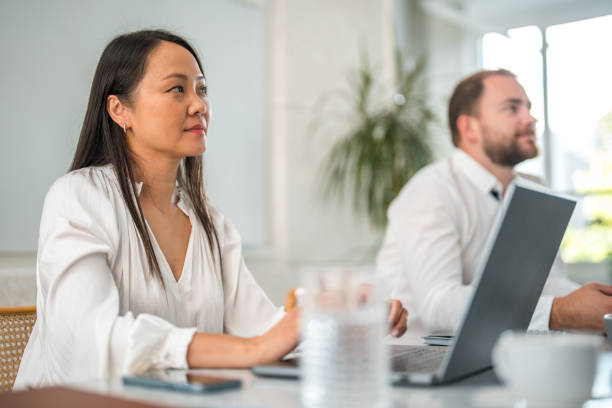 istock Pretty Asian Businesswoman At Work 1908717066