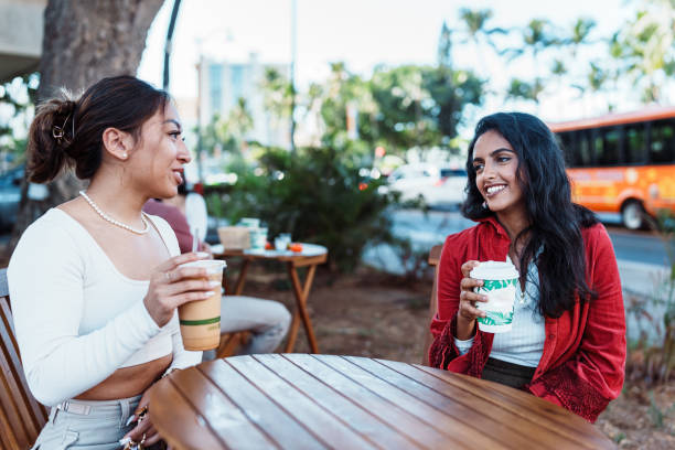 istock Two women sit outside on a lunch date 1908754742