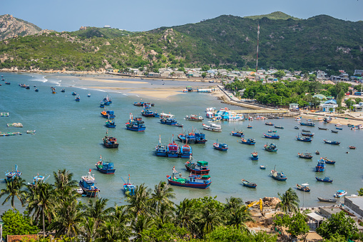 Beautiful scenery of Phan Rang, beaches with wooden boats, wind power poles in rice fields