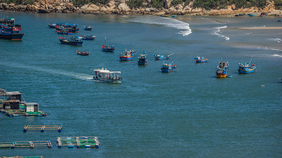 Beautiful scenery of Phan Rang, beaches with wooden boats, wind power poles in rice fields