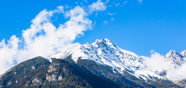 High mountain landscape with sun in the French Alps (La Grave, La Meije)