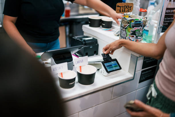 istock Woman paying for shave ice at shop checkout counter 1908872488