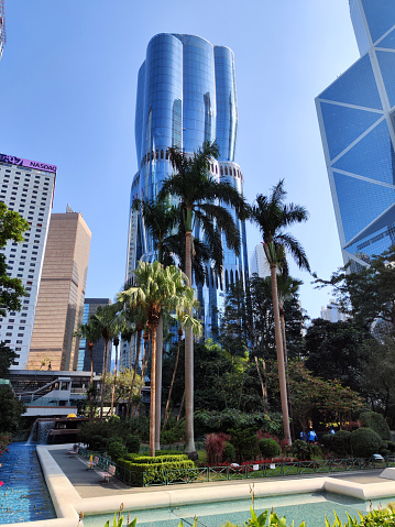 View of Chater garden and the Henderson skyscraper in Hong Kong Central district, an under construction 190 mt tall skyscraper designed by Zaha Hadid Architects. The tower's exterior is inspired by a blossoming bauhinia, the flower that has appeared on Hong Kong's flag since Britain handed control of the territory back to China in 1997.