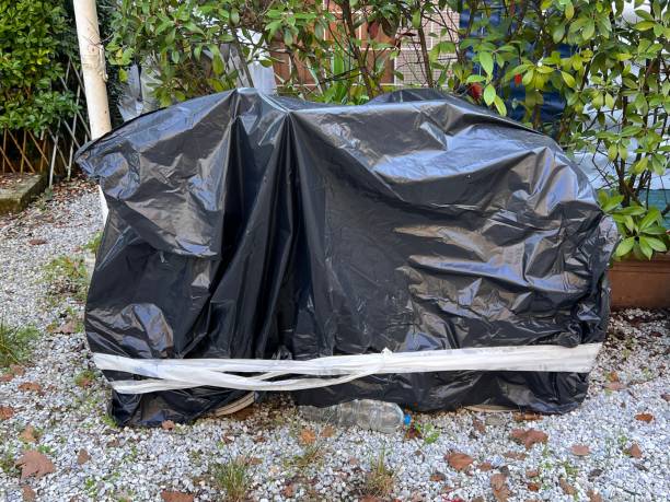 istock campsite in Italy - with a black plastic foil covered motorbike 1908887699