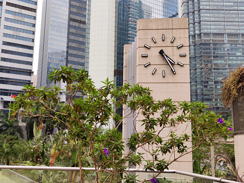 View of Harcourt garden clock tower, surrounded by the Arsenal House building. Harcourt garden is a small urban park in Admiralty, Hong Kong, constructed in the mid-1990s.