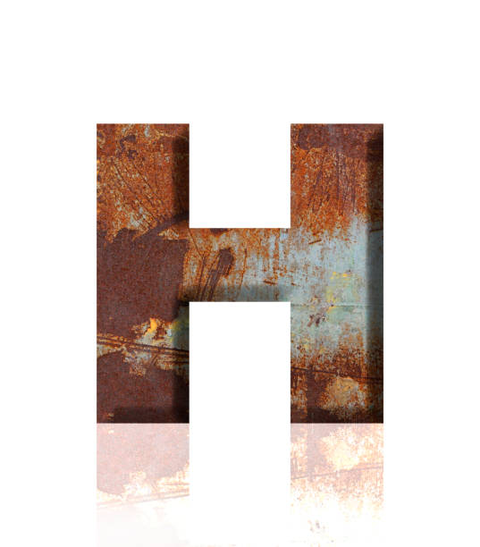 istock Isolated shot of three-dimensional rusty metal alphabet letter H on white background 1908906740