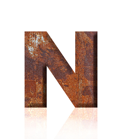 Close-up of three-dimensional rusty metal alphabet letter N on white background.