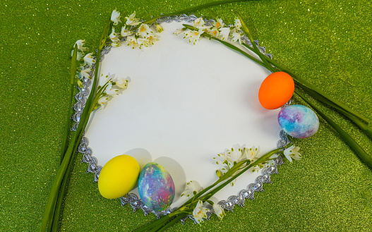 Happy easter! Flat Lay, postcard or Internet banner with Copy Space on Easter.  Snowdrop flowers and easter eggs