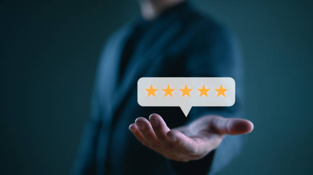 istock Businessman or customer showing popup five-star icon for feedback review satisfaction service, Customer service experience and business satisfaction survey. Quality control, best, good. 1908974320