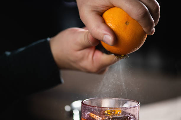 istock Bartender Enhances Negroni Cocktail with Orange Peel 1908999355