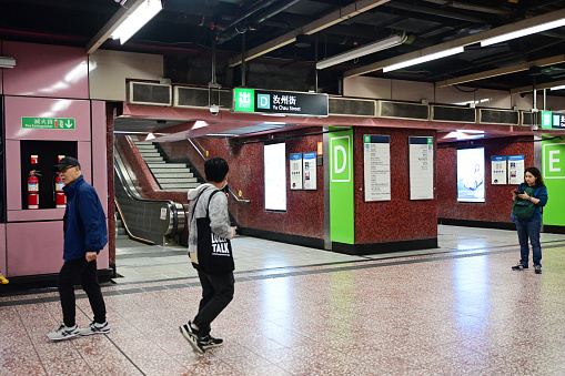 Train station in Barcelona with people walking.