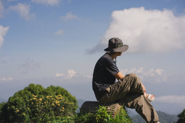 istock landscape and travel concept with solo freelancer man work and see cloud and sky with layer of mountain 1909009316