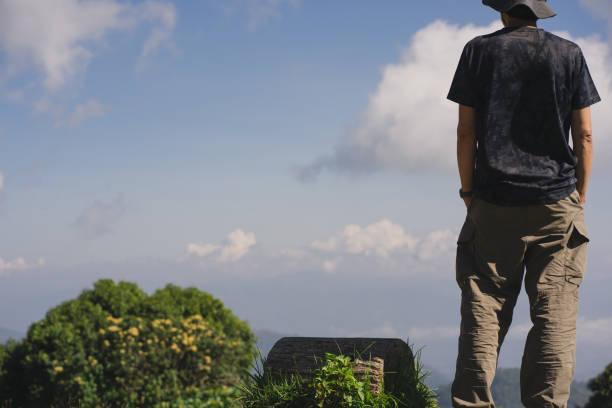 istock landscape and travel concept with solo freelancer man work and see cloud and sky with layer of mountain 1909009848