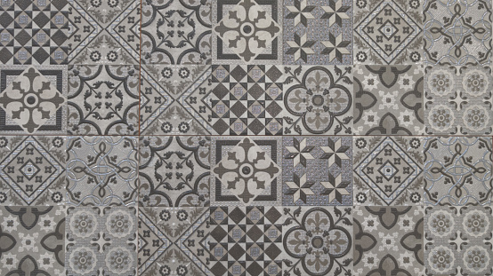 A large area of repeating patterned tiles on the exterior of an apartment building in the Portuguese capital city of Lisbon.