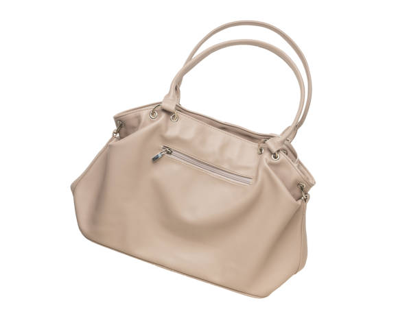 istock A large beige women's bag isolated on a white background. 1909034770