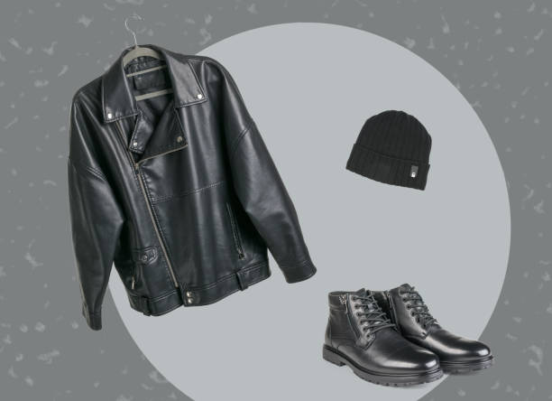 A set of clothes from a jacket, hat and boots on an abstract background.