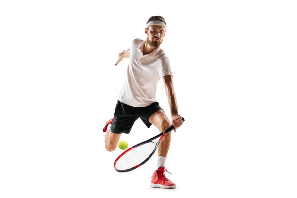 istock Competitive man, tennis player during game in motion, hitting ball with racket, playing isolated over white background. Sport 1909046577