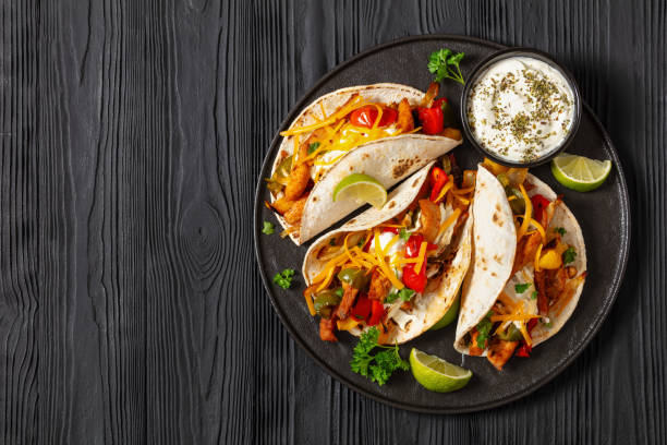 istock baked tex-mex chicken fajitas on a plate, top view 1909058311
