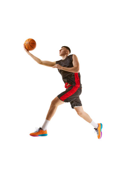 istock Slum dunk. Winner. Young guy, basketball player in motion, practicing, playing isolated over white background. Sport concept 1909077267