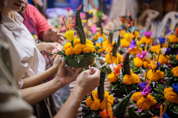 istock Smiling couple choosing krathong 1909096058