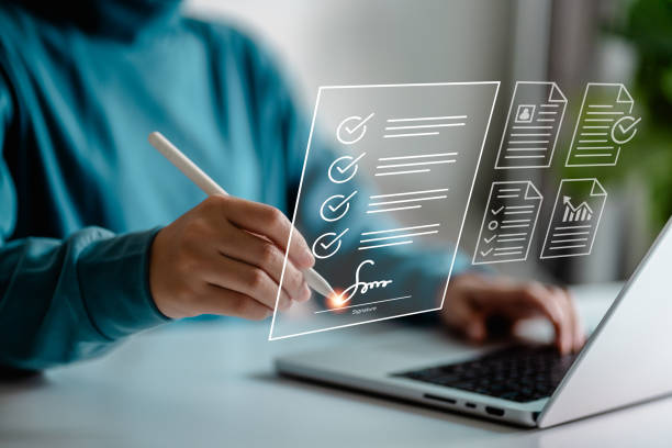 istock Businesswomen use a stylus pen to sign electronic documents on digital documents on a virtual screen, Electronic signature concept, E-signing, information technology and document management. 1909108591